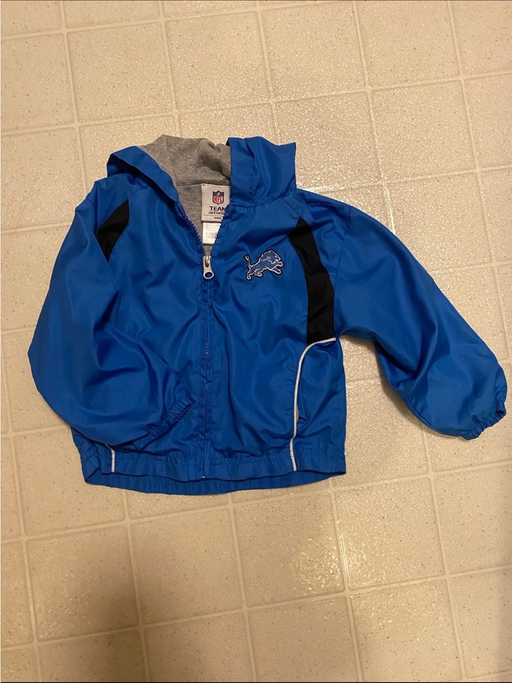 NFL Kids Blue Hooded Rain Jacket with Black Accents